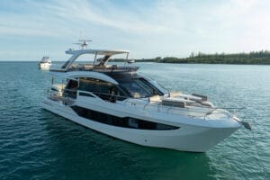 Luxurious white superyacht on calm blue waters in Miami, showcasing elegant design with spacious decks and modern amenities, ideal for exclusive yacht charters and high-end rentals.