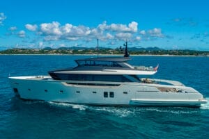 Luxury superyacht cruising on the blue waters near Miami, showcasing sleek design and spacious decks, perfect for exclusive yacht charters and rentals.